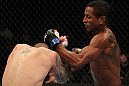 FAIRFAX, VA - MAY 15:  (R-L) Johnny Eduardo punches Jeff Curran in a bantamweight bout during the UFC on Fuel TV event at Patriot Center on May 15, 2012 in Fairfax, Virginia.  (Photo by Josh Hedges/Zuffa LLC/Zuffa LLC via Getty Images)