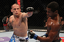 FAIRFAX, VA - MAY 15:  (L-R) Jeff Curran punches Johnny Eduardo in a bantamweight bout during the UFC on Fuel TV event at Patriot Center on May 15, 2012 in Fairfax, Virginia.  (Photo by Josh Hedges/Zuffa LLC/Zuffa LLC via Getty Images)