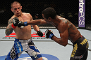 FAIRFAX, VA - MAY 15:  (R-L) Johnny Eduardo punches Jeff Curran in a bantamweight bout during the UFC on Fuel TV event at Patriot Center on May 15, 2012 in Fairfax, Virginia.  (Photo by Josh Hedges/Zuffa LLC/Zuffa LLC via Getty Images)