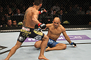 FAIRFAX, VA - MAY 15:  (L-R) Rafael Dos Anjos rushes in to finish Kamal Shalorus after knocking him down with a kick in a lightweight bout during the UFC on Fuel TV event at Patriot Center on May 15, 2012 in Fairfax, Virginia.  (Photo by Josh Hedges/Zuffa LLC/Zuffa LLC via Getty Images)