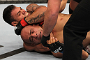 FAIRFAX, VA - MAY 15:  (L-R) Rafael Dos Anjos defeats Kamal Shalorus with a rear choke submisssion in a lightweight bout during the UFC on Fuel TV event at Patriot Center on May 15, 2012 in Fairfax, Virginia.  (Photo by Josh Hedges/Zuffa LLC/Zuffa LLC via Getty Images)