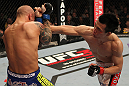 FAIRFAX, VA - MAY 15:  (R-L) "The Korean Zombie" Chan Sung Jung punches Dustin Poirier in a featherweight bout during the UFC on Fuel TV event at Patriot Center on May 15, 2012 in Fairfax, Virginia.  (Photo by Josh Hedges/Zuffa LLC/Zuffa LLC via Getty Images)