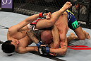 FAIRFAX, VA - MAY 15:  (L-R) "The Korean Zombie" Chan Sung Jung attempts to secure a triangle choke submission against Dustin Poirier in a featherweight bout during the UFC on Fuel TV event at Patriot Center on May 15, 2012 in Fairfax, Virginia.  (Photo by Josh Hedges/Zuffa LLC/Zuffa LLC via Getty Images)