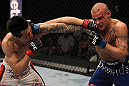 FAIRFAX, VA - MAY 15:  (L-R) "The Korean Zombie" Chan Sung Jung and Dustin Poirier trade punches in a featherweight bout during the UFC on Fuel TV event at Patriot Center on May 15, 2012 in Fairfax, Virginia.  (Photo by Josh Hedges/Zuffa LLC/Zuffa LLC via Getty Images)