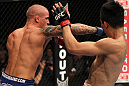 FAIRFAX, VA - MAY 15:  (L-R) Dustin Poirier punches "The Korean Zombie" Chan Sung Jung in a featherweight bout during the UFC on Fuel TV event at Patriot Center on May 15, 2012 in Fairfax, Virginia.  (Photo by Josh Hedges/Zuffa LLC/Zuffa LLC via Getty Images)