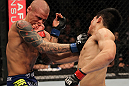 FAIRFAX, VA - MAY 15:  (R-L) "The Korean Zombie" Chan Sung Jung punches Dustin Poirier in a featherweight bout during the UFC on Fuel TV event at Patriot Center on May 15, 2012 in Fairfax, Virginia.  (Photo by Josh Hedges/Zuffa LLC/Zuffa LLC via Getty Images)