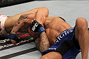FAIRFAX, VA - MAY 15:  (L-R) "The Korean Zombie" Chan Sung Jung defeats Dustin Poirier with a d'arce choke submission in a featherweight bout during the UFC on Fuel TV event at Patriot Center on May 15, 2012 in Fairfax, Virginia.  (Photo by Josh Hedges/Zuffa LLC/Zuffa LLC via Getty Images)