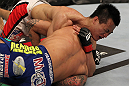FAIRFAX, VA - MAY 15:  (L-R) "The Korean Zombie" Chan Sung Jung defeats Dustin Poirier with a d'arce choke submission in a featherweight bout during the UFC on Fuel TV event at Patriot Center on May 15, 2012 in Fairfax, Virginia.  (Photo by Josh Hedges/Zuffa LLC/Zuffa LLC via Getty Images)