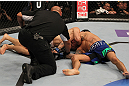 FAIRFAX, VA - MAY 15:  (L-R) "The Korean Zombie" Chan Sung Jung defeats Dustin Poirier with a d'arce choke submission in a featherweight bout during the UFC on Fuel TV event at Patriot Center on May 15, 2012 in Fairfax, Virginia.  (Photo by Josh Hedges/Zuffa LLC/Zuffa LLC via Getty Images)