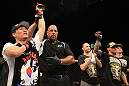 FAIRFAX, VA - MAY 15:  "The Korean Zombie" Chan Sung Jung (L) reacts after defeating Dustin Poirier in a featherweight bout during the UFC on Fuel TV event at Patriot Center on May 15, 2012 in Fairfax, Virginia.  (Photo by Josh Hedges/Zuffa LLC/Zuffa LLC via Getty Images)
