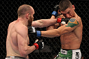 FAIRFAX, VA - MAY 15:  (L-R) TJ Grant punches Carlo Prater in a lightweight bout during the UFC on Fuel TV event at Patriot Center on May 15, 2012 in Fairfax, Virginia.  (Photo by Josh Hedges/Zuffa LLC/Zuffa LLC via Getty Images)