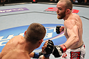 FAIRFAX, VA - MAY 15:  (R-L) TJ Grant punches Carlo Prater in a lightweight bout during the UFC on Fuel TV event at Patriot Center on May 15, 2012 in Fairfax, Virginia.  (Photo by Josh Hedges/Zuffa LLC/Zuffa LLC via Getty Images)
