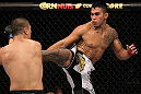 FAIRFAX, VA - MAY 15:  (R-L) Brad Tavares kicks Dongi Yang in a middleweight bout during the UFC on Fuel TV event at Patriot Center on May 15, 2012 in Fairfax, Virginia.  (Photo by Josh Hedges/Zuffa LLC/Zuffa LLC via Getty Images)