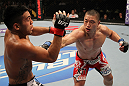 FAIRFAX, VA - MAY 15:  (R-L) Dongi Yang punches Brad Tavares in a middleweight bout during the UFC on Fuel TV event at Patriot Center on May 15, 2012 in Fairfax, Virginia.  (Photo by Josh Hedges/Zuffa LLC/Zuffa LLC via Getty Images)