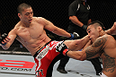FAIRFAX, VA - MAY 15:  (L-R) Dongi Yang kicks Brad Tavares in a middleweight bout during the UFC on Fuel TV event at Patriot Center on May 15, 2012 in Fairfax, Virginia.  (Photo by Josh Hedges/Zuffa LLC/Zuffa LLC via Getty Images)