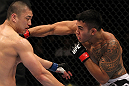 FAIRFAX, VA - MAY 15:  (R-L) Brad Tavares punches Dongi Yang in a middleweight bout during the UFC on Fuel TV event at Patriot Center on May 15, 2012 in Fairfax, Virginia.  (Photo by Josh Hedges/Zuffa LLC/Zuffa LLC via Getty Images)