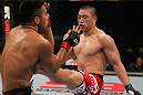 FAIRFAX, VA - MAY 15:  (R-L) Dongi Yang kicks Brad Tavares in a middleweight bout during the UFC on Fuel TV event at Patriot Center on May 15, 2012 in Fairfax, Virginia.  (Photo by Josh Hedges/Zuffa LLC/Zuffa LLC via Getty Images)