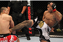 FAIRFAX, VA - MAY 15:  (R-L) Brad Tavares kicks Dongi Yang in a middleweight bout during the UFC on Fuel TV event at Patriot Center on May 15, 2012 in Fairfax, Virginia.  (Photo by Josh Hedges/Zuffa LLC/Zuffa LLC via Getty Images)