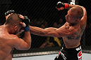 FAIRFAX, VA - MAY 15:  (R-L) Donald "Cowboy" Cerrone punches Jeremy Stephens in a lightweight bout during the UFC on Fuel TV event at Patriot Center on May 15, 2012 in Fairfax, Virginia.  (Photo by Josh Hedges/Zuffa LLC/Zuffa LLC via Getty Images)