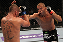 FAIRFAX, VA - MAY 15:  (R-L) Donald "Cowboy" Cerrone punches Jeremy Stephens in a lightweight bout during the UFC on Fuel TV event at Patriot Center on May 15, 2012 in Fairfax, Virginia.  (Photo by Josh Hedges/Zuffa LLC/Zuffa LLC via Getty Images)