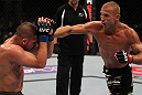 FAIRFAX, VA - MAY 15:  (R-L) Donald "Cowboy" Cerrone punches Jeremy Stephens in a lightweight bout during the UFC on Fuel TV event at Patriot Center on May 15, 2012 in Fairfax, Virginia.  (Photo by Josh Hedges/Zuffa LLC/Zuffa LLC via Getty Images)