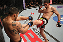 FAIRFAX, VA - MAY 15:  (R-L) Amir Sadollah kicks Jorge Lopez in a welterweight bout during the UFC on Fuel TV event at Patriot Center on May 15, 2012 in Fairfax, Virginia.  (Photo by Josh Hedges/Zuffa LLC/Zuffa LLC via Getty Images)