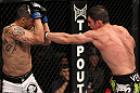 FAIRFAX, VA - MAY 15:  (R-L) Amir Sadollah punches Jorge Lopez in a welterweight bout during the UFC on Fuel TV event at Patriot Center on May 15, 2012 in Fairfax, Virginia.  (Photo by Josh Hedges/Zuffa LLC/Zuffa LLC via Getty Images)