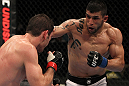FAIRFAX, VA - MAY 15:  (R-L) Jorge Lopez punches Amir Sadollah in a welterweight bout during the UFC on Fuel TV event at Patriot Center on May 15, 2012 in Fairfax, Virginia.  (Photo by Josh Hedges/Zuffa LLC/Zuffa LLC via Getty Images)