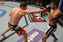 FAIRFAX, VA - MAY 15:  (L-R) Amir Sadollah punches Jorge Lopez in a welterweight bout during the UFC on Fuel TV event at Patriot Center on May 15, 2012 in Fairfax, Virginia.  (Photo by Josh Hedges/Zuffa LLC/Zuffa LLC via Getty Images)