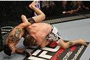 LAS VEGAS, NV - MAY 26:  (R-L) Mike Brown slams Daniel Pineda during a light featherweight bout at UFC 146 at MGM Grand Garden Arena on May 26, 2012 in Las Vegas, Nevada.  (Photo by Donald Miralle/Zuffa LLC/Zuffa LLC via Getty Images)
