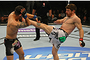 LAS VEGAS, NV - MAY 26:  (R-L) Mike Brown kicks Daniel Pineda during a light featherweight bout at UFC 146 at MGM Grand Garden Arena on May 26, 2012 in Las Vegas, Nevada.  (Photo by Donald Miralle/Zuffa LLC/Zuffa LLC via Getty Images)