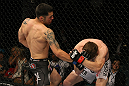 LAS VEGAS, NV - MAY 26:  (L-R) Daniel Pineda punches Mike Brown during a light featherweight bout at UFC 146 at MGM Grand Garden Arena on May 26, 2012 in Las Vegas, Nevada.  (Photo by Donald Miralle/Zuffa LLC/Zuffa LLC via Getty Images)