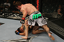 LAS VEGAS, NV - MAY 26:  Mike Brown (white shorts) punches Daniel Pineda during a light featherweight bout at UFC 146 at MGM Grand Garden Arena on May 26, 2012 in Las Vegas, Nevada.  (Photo by Donald Miralle/Zuffa LLC/Zuffa LLC via Getty Images)