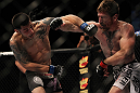 LAS VEGAS, NV - MAY 26:  (L-R) Daniel Pineda and Mike Brown exchange punches during a light featherweight bout at UFC 146 at MGM Grand Garden Arena on May 26, 2012 in Las Vegas, Nevada.  (Photo by Josh Hedges/Zuffa LLC/Zuffa LLC via Getty Images)