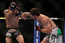 LAS VEGAS, NV - MAY 26:  (R-L) Mike Brown punches Daniel Pineda during a light featherweight bout at UFC 146 at MGM Grand Garden Arena on May 26, 2012 in Las Vegas, Nevada.  (Photo by Josh Hedges/Zuffa LLC/Zuffa LLC via Getty Images)