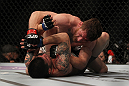 LAS VEGAS, NV - MAY 26: Mike Brown (top) punches Daniel Pineda during a light featherweight bout at UFC 146 at MGM Grand Garden Arena on May 26, 2012 in Las Vegas, Nevada. (Photo by Josh Hedges/Zuffa LLC/Zuffa LLC via Getty Images)