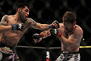 LAS VEGAS, NV - MAY 26:  Daniel Pineda (left) punches Mike Brown during a light featherweight bout at UFC 146 at MGM Grand Garden Arena on May 26, 2012 in Las Vegas, Nevada.  (Photo by Josh Hedges/Zuffa LLC/Zuffa LLC via Getty Images)