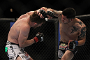 LAS VEGAS, NV - MAY 26: Daniel Pineda (right) punches Mike Brown during a light featherweight bout at UFC 146 at MGM Grand Garden Arena on May 26, 2012 in Las Vegas, Nevada. (Photo by Josh Hedges/Zuffa LLC/Zuffa LLC via Getty Images)
