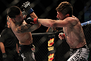 LAS VEGAS, NV - MAY 26:  Mike Brown (right) punches Daniel Pineda during a light featherweight bout at UFC 146 at MGM Grand Garden Arena on May 26, 2012 in Las Vegas, Nevada.  (Photo by Josh Hedges/Zuffa LLC/Zuffa LLC via Getty Images)