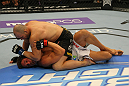 LAS VEGAS, NV - MAY 26:  Glover Teixeira (top) punches Kyle Kingsbury during a light heavyweight bout at UFC 146 at MGM Grand Garden Arena on May 26, 2012 in Las Vegas, Nevada.  (Photo by Donald Miralle/Zuffa LLC/Zuffa LLC via Getty Images)