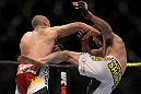 LAS VEGAS, NV - MAY 26:  (L-R) Paul Sass punches Jacob Volkmann during a lightweight bout at UFC 146 at MGM Grand Garden Arena on May 26, 2012 in Las Vegas, Nevada.  (Photo by Josh Hedges/Zuffa LLC/Zuffa LLC via Getty Images)