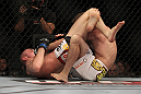 LAS VEGAS, NV - MAY 26:  Paul Sass (left) attempts to submit Jacob Volkmann during a lightweight bout at UFC 146 at MGM Grand Garden Arena on May 26, 2012 in Las Vegas, Nevada.  (Photo by Josh Hedges/Zuffa LLC/Zuffa LLC via Getty Images)