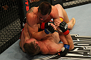 LAS VEGAS, NV - MAY 26:  CB Dollaway (top) punches Jason Miller during a middleweight bout at UFC 146 at MGM Grand Garden Arena on May 26, 2012 in Las Vegas, Nevada.  (Photo by Donald Miralle/Zuffa LLC/Zuffa LLC via Getty Images)