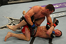 LAS VEGAS, NV - MAY 26:  CB Dollaway (top) punches Jason Miller during a middleweight bout at UFC 146 at MGM Grand Garden Arena on May 26, 2012 in Las Vegas, Nevada.  (Photo by Donald Miralle/Zuffa LLC/Zuffa LLC via Getty Images)