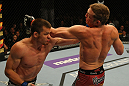 LAS VEGAS, NV - MAY 26:  CB Dollaway (L) punches Jason Miller during a middleweight bout at UFC 146 at MGM Grand Garden Arena on May 26, 2012 in Las Vegas, Nevada.  (Photo by Donald Miralle/Zuffa LLC/Zuffa LLC via Getty Images)