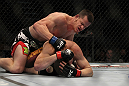 LAS VEGAS, NV - MAY 26:  CB Dollaway (top) punches Jason Miller during a middleweight bout at UFC 146 at MGM Grand Garden Arena on May 26, 2012 in Las Vegas, Nevada.  (Photo by Josh Hedges/Zuffa LLC/Zuffa LLC via Getty Images)