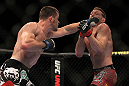 LAS VEGAS, NV - MAY 26:  CB Dollaway (left) punches Jason Miller during a middleweight bout at UFC 146 at MGM Grand Garden Arena on May 26, 2012 in Las Vegas, Nevada.  (Photo by Josh Hedges/Zuffa LLC/Zuffa LLC via Getty Images)