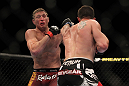 LAS VEGAS, NV - MAY 26:  CB Dollaway (right) punches Jason Miller during a middleweight bout at UFC 146 at MGM Grand Garden Arena on May 26, 2012 in Las Vegas, Nevada.  (Photo by Josh Hedges/Zuffa LLC/Zuffa LLC via Getty Images)