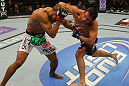 LAS VEGAS, NV - MAY 26:  Jamie Varner (R) punches Edson Barboza during a lightweight bout at UFC 146 at MGM Grand Garden Arena on May 26, 2012 in Las Vegas, Nevada.  (Photo by Donald Miralle/Zuffa LLC/Zuffa LLC via Getty Images)