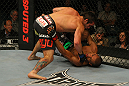 LAS VEGAS, NV - MAY 26:  Jamie Varner (top) punches Edson Barboza during a lightweight bout at UFC 146 at MGM Grand Garden Arena on May 26, 2012 in Las Vegas, Nevada.  (Photo by Donald Miralle/Zuffa LLC/Zuffa LLC via Getty Images)